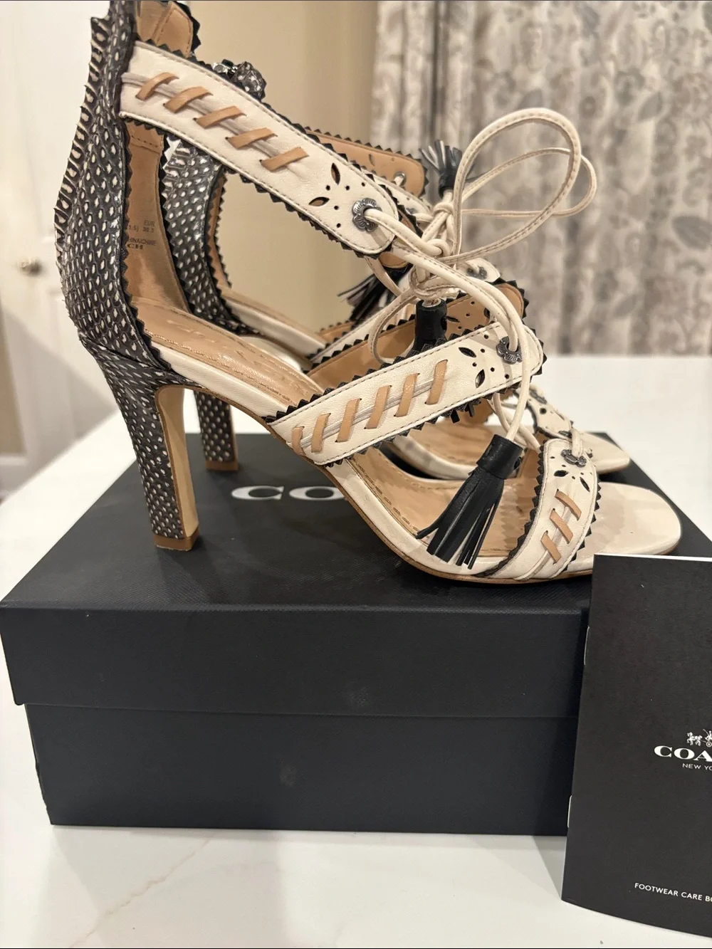Coach Ivory and Black Studded Tassel High Heel Sandals